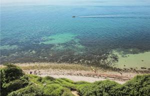 a group of people on a beach in the water at Stunning Apartment In Samsø With Wifi in Kolby Kås +21 photos