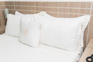 Ένα ή περισσότερα κρεβάτια σε δωμάτιο στο Hotel Cinco Monteria