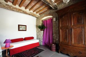 A bed or beds in a room at Gli Appartamenti Di Torre Bertona