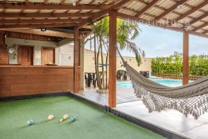 Galería fotográfica de Casa Luz de Verano Piscina Climatizada en Pinheira en Pinheira