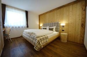 Giường trong phòng chung tại Chalet Apartments Ambria