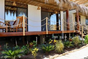a house with a porch and a balcony at La Vidita 891 - Piscinas, Lobitos in Lobitos