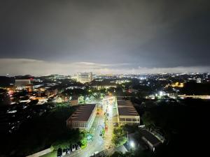 a view of a city at night with lights at Taman Melati Yogyakarta Apartement 1240 in Kejayan