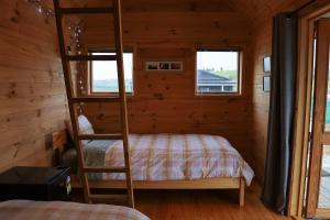 Postel nebo postele na pokoji v ubytování Kauri Ora Farmstay + 35 fotografií