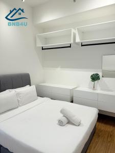 Ένα ή περισσότερα κρεβάτια σε δωμάτιο στο Beacon Executive Suites - Georgetown Penang +53 φωτογραφίες