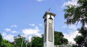 a tall clock tower with a clock on it at ATAP Hotel in Kota Kinabalu