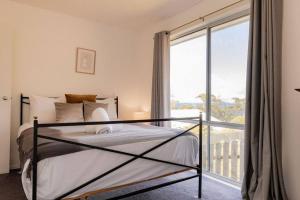 Postel nebo postele na pokoji v ubytování Suntrap Cove - you and the ocean + 23 fotografií