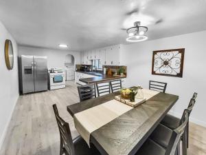 a dining room and kitchen with a table and chairs at Sparn Mountain Hideaway home in Grand Junction