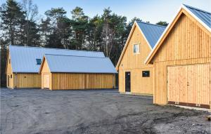 two barns with two garage at 4 Bedroom Stunning Home In Ystad in Ystad +16 photos