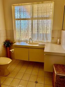 a bathroom with a sink and a window at Myra Downs in Harvey +20 photos