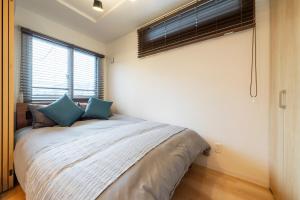 Voodi või voodid majutusasutuse Unison toas