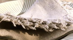 a piece of white cloth sitting on top of a napkin at La Saracina in Pienza