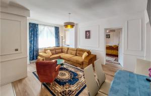 a living room with a couch and a table at 1 Bedroom Cozy Apartment In Kolobrzeg in Kołobrzeg