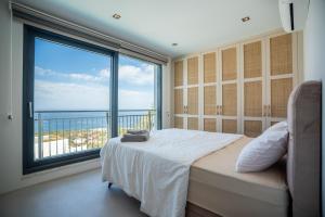 Ένα ή περισσότερα κρεβάτια σε δωμάτιο στο Orga Homes Cyprus MUP +234 φωτογραφίες