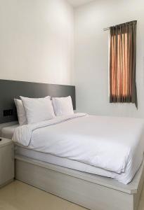 Ein Bett oder Betten in einem Zimmer der Unterkunft Binumar Guest House