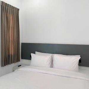 Ein Bett oder Betten in einem Zimmer der Unterkunft Binumar Guest House