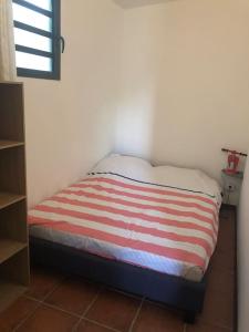 Postel nebo postele na pokoji v ubytování Ti Payanké