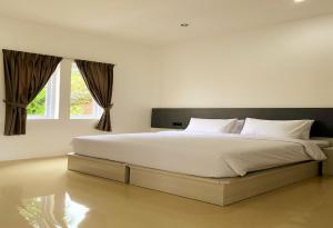 Ein Bett oder Betten in einem Zimmer der Unterkunft Binumar Guest House