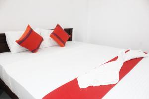 Postel nebo postele na pokoji v ubytování Ganga Homestay Sigiriya