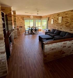a living room with a couch and a table at Myra Downs in Harvey
