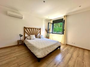 Postel nebo postele na pokoji v ubytování La VILLA MAHOT