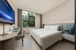 Televisor o centre d'entreteniment de Atour Light Hotel Guangzhou Taikoo Hui Zhengjia Plaza-Free shuttle bus to Canton Fair