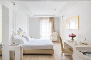 מיטה או מיטות בחדר ב-Boscolo Nice Hotel & Spa