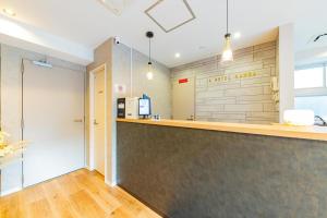 a bar in a restaurant with a counter at JA Hotel Namba in Osaka