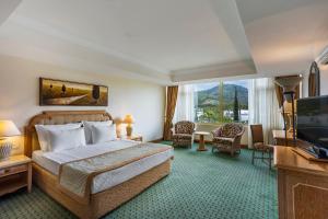 TV a/nebo společenská místnost v ubytování Simena Comfort Hotel