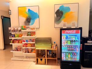 a coca cola refrigerator in a grocery store at Michi Hotel - Zhongli in Zhongli