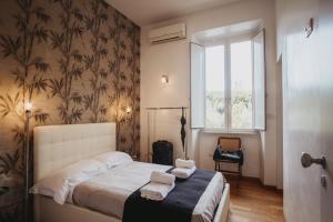 Postel nebo postele na pokoji v ubytování circo massimo camere