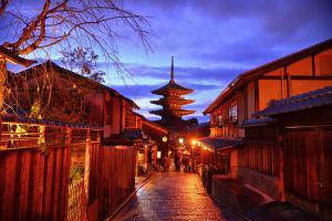 a street in an asian city with a pagoda in the background at Four Points Flex by Sheraton Kyoto Oike in Kyoto