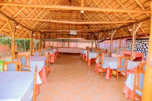 a group of tables and chairs in a pavilion at Kigali diplomat Hotel in Kigali