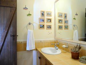 a bathroom with a sink and a mirror at Stunning seafront apartment in Kea in Korissia +49 photos