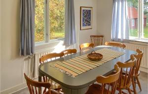 a dining room with a table and chairs at 6 Bedroom Gorgeous Home In Tranås in Tranås