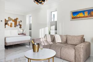 a living room with a couch and a table at F-Apartments - River view, Contactless in Tartu