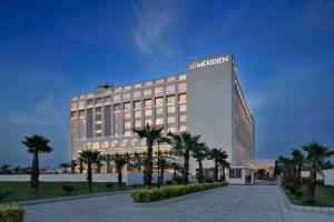 a large building with aania sign on top of it at Le Meridien Amritsar in Amritsar +89 photos