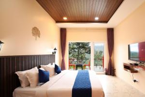 Postel nebo postele na pokoji v ubytování Coastal Grand Resorts - Akshaya