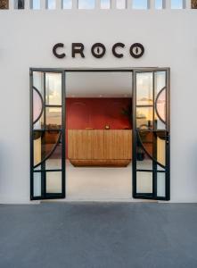 Cama ou camas em um quarto em Croco Mykonos
