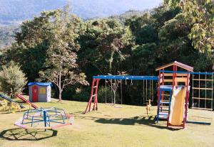 a group of playground equipment in a park at Bosque dos Beija-Flores Pousada e Spa in São Thomé das Letras