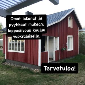 a red house with the words ont landmark in pymster michigan at Villa Oiva in Ylihärmä