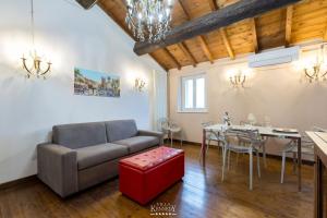 a living room with a couch and a table at Apartment Villa Kennedy - Bob in Sirmione +31 photos