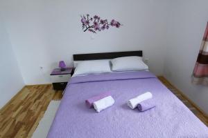 Postel nebo postele na pokoji v ubytování Apartments Renato