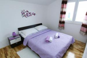 Postel nebo postele na pokoji v ubytování Apartments Renato