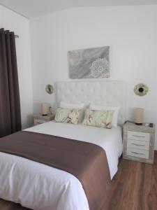 Postel nebo postele na pokoji v ubytování Sandra Rooms