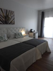 Postel nebo postele na pokoji v ubytování Sandra Rooms