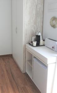 Kuchyň nebo kuchyňský kout v ubytování Sandra Rooms
