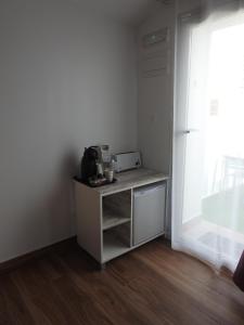 Kuchyň nebo kuchyňský kout v ubytování Sandra Rooms