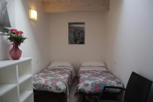 Letto o letti in una camera di Camera & Caffè Cenni