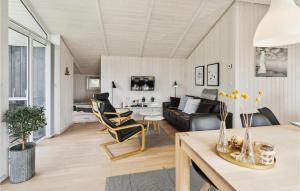a living room with a couch and a table at Holiday Home Sydals With Hot Tub Vii in Sarup